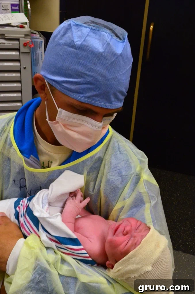 Father and son, Jon holding Ryder for the first time.