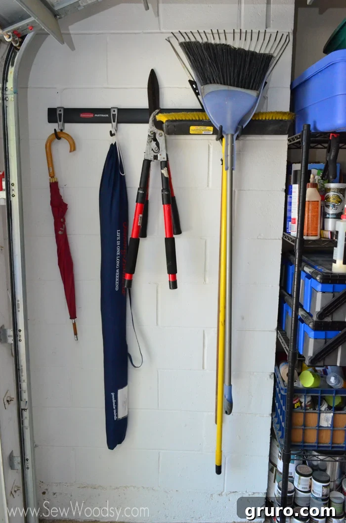 Our beautifully organized garage corner with Rubbermaid FastTrack, ready for more projects