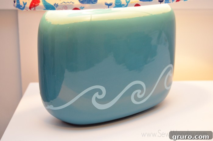 Detailed shot of the custom vinyl wave on the lamp base