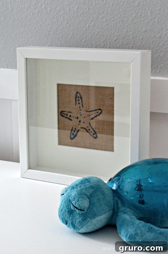 Rustic Sea Star Craft 12 A stunning close-up of the finished Burlap Starfish Art, framed and ready for display, highlighting the crisp stencil work and the charming texture of burlap, ideal for any beach-themed home.