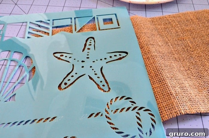 Rustic Sea Star Craft 5 Step-by-step image showing paint being squeezed onto a plate and the starfish stencil being carefully aligned on the burlap fabric for the Burlap Starfish Art project.