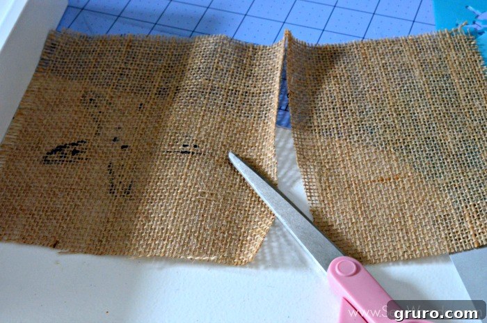Rustic Sea Star Craft 9 The process of trimming the burlap fabric to fit precisely within the picture frame after the starfish design has dried, for the DIY Burlap Starfish Art project.