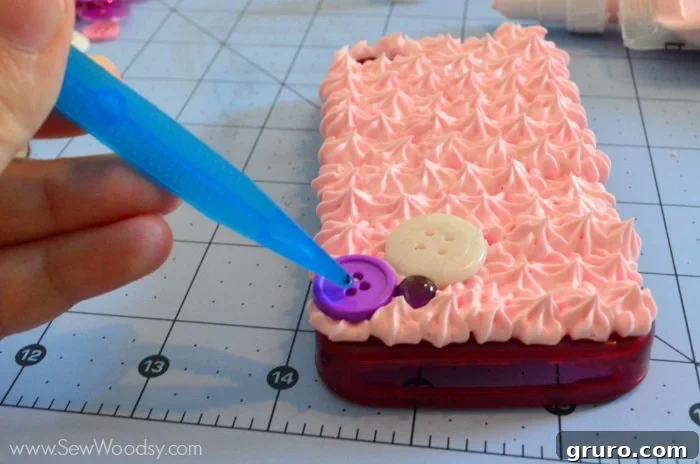 A fully covered cell phone case showing the complete application of Strawberry Pink Mod Podge Collage Clay, now resembling a soft, fluffy whipped topping. The textured surface is ready for decorative elements, showcasing the initial success of the Decoden base.