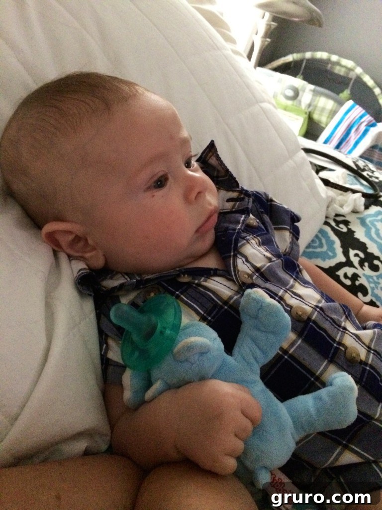 Baby Ryder exploring and engaging with his new collection of infant toys