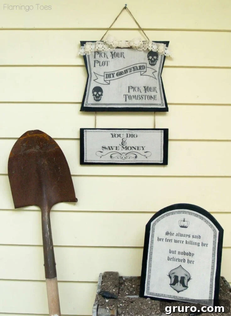 A DIY graveyard scene with various tombstones, some lit up, creating a spooky outdoor Halloween display.