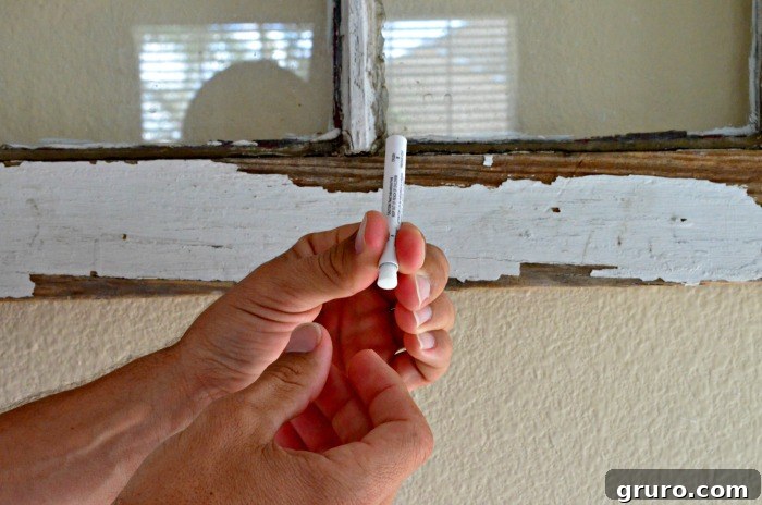 LeadCheck 3: Cleaning the surface of an antique window frame before lead testing.