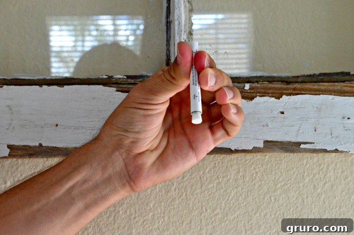 LeadCheck 4: Squeezing point A on the 3M LeadCheck Swab to activate it.