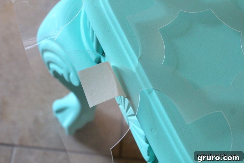 Stunning Table Transformations: Stencil Art & A Giveaway Event 2 Painter's tape securing the stencil to the table surface.