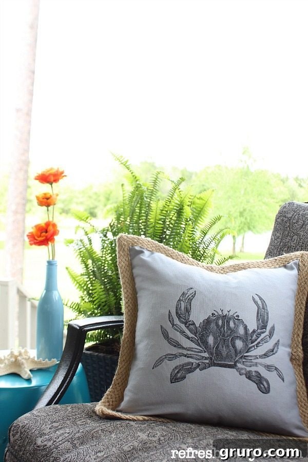 Personalized outdoor living space featuring a comfortable seating area with custom crab pillows, adding a unique coastal touch to the decor.