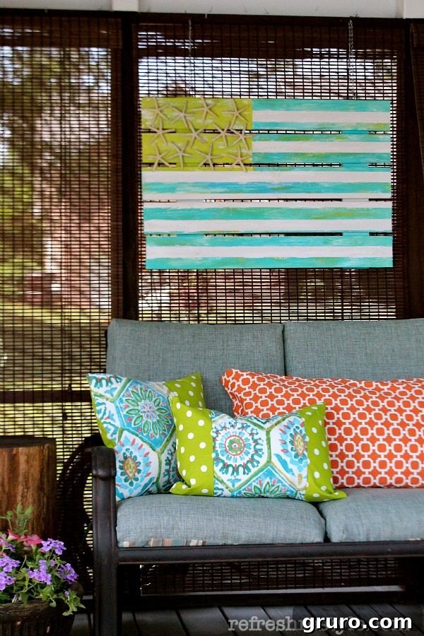 Creative outdoor art made from an old picket fence, showcasing a unique way to decorate an exterior space.