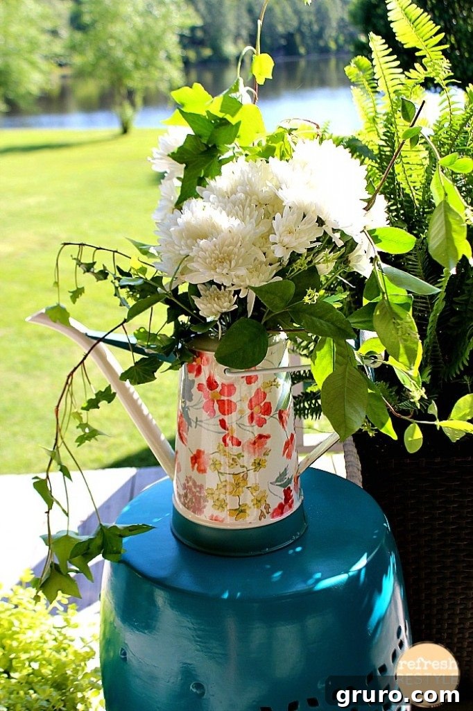 Fresh flowers beautifully arranged in a watering can, serving as a charming and instant centerpiece for outdoor entertaining.