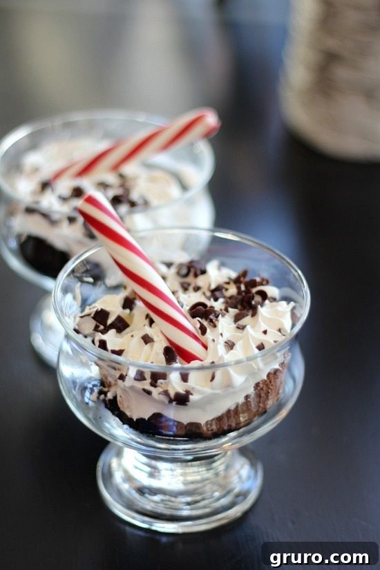 Marie Callender's Chocolate Satin Pie, garnished with festive peppermint sticks, a perfect no-fuss dessert.