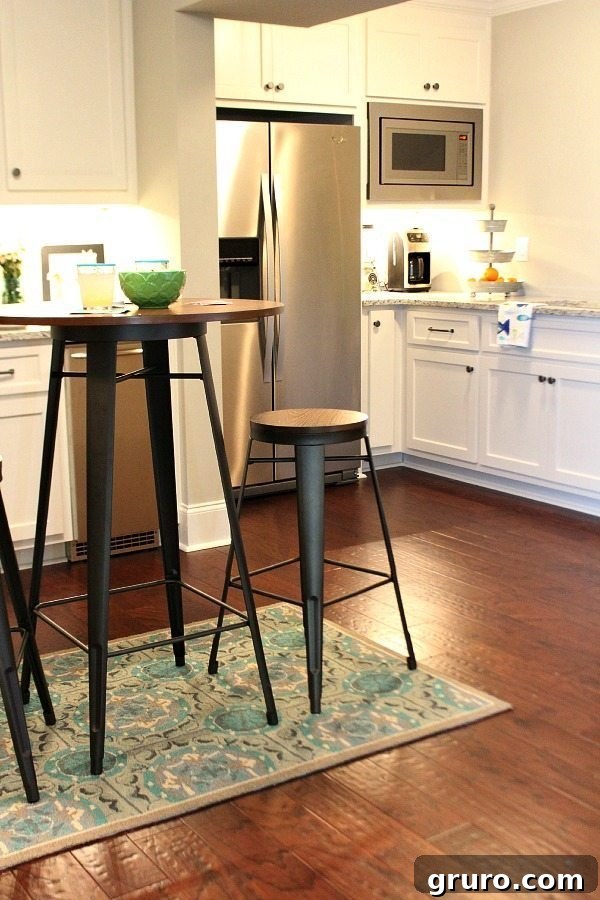 Basement kitchen featuring a pub table and serving station