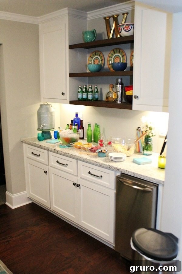 Basement makeover showcasing a modern serving area with ice machine