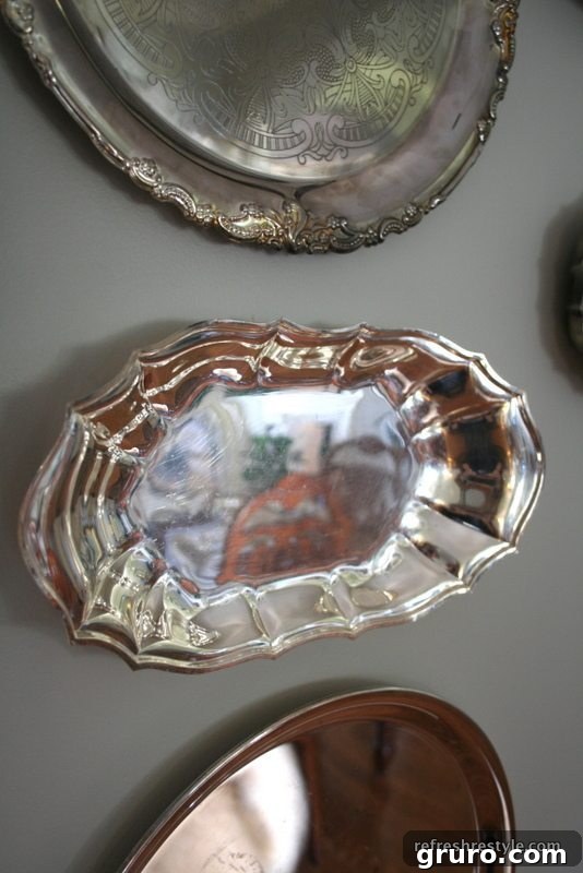 Crafting Your Perfect Gallery Wall 14 Gallery wall with hung silver