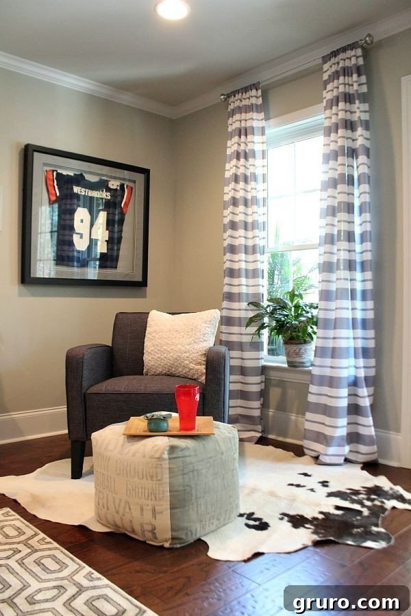 Striped curtains from BHG at Walmart adding style to the finished basement space at refreshrestyle.com