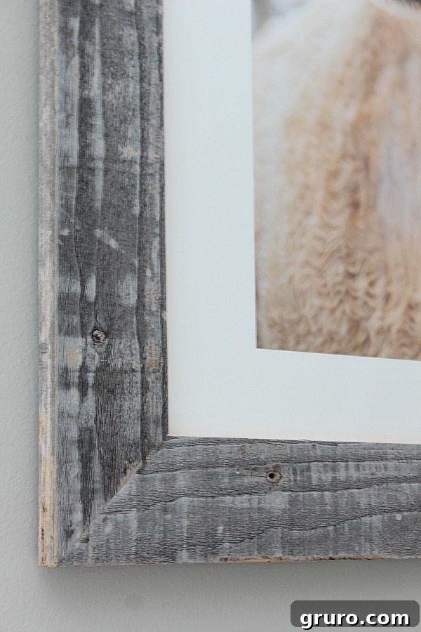 Real barnwood frame on art above guest room bed