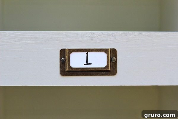 Rustic Charm Storage Cubes 11 Metal label holders enhance the organized, rustic look of the laminate cube organizer