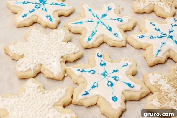 Ultimate Christmas Cookie Giveaway 3 Close-up of elegantly decorated Christmas cookies with pearls, golden sugar, and stars