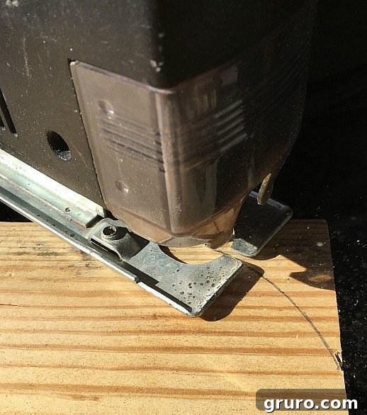 Build Your Industrial Cart Coffee Table 10 Using a jig saw to cut the rounded corners of the industrial coffee table's wooden top.