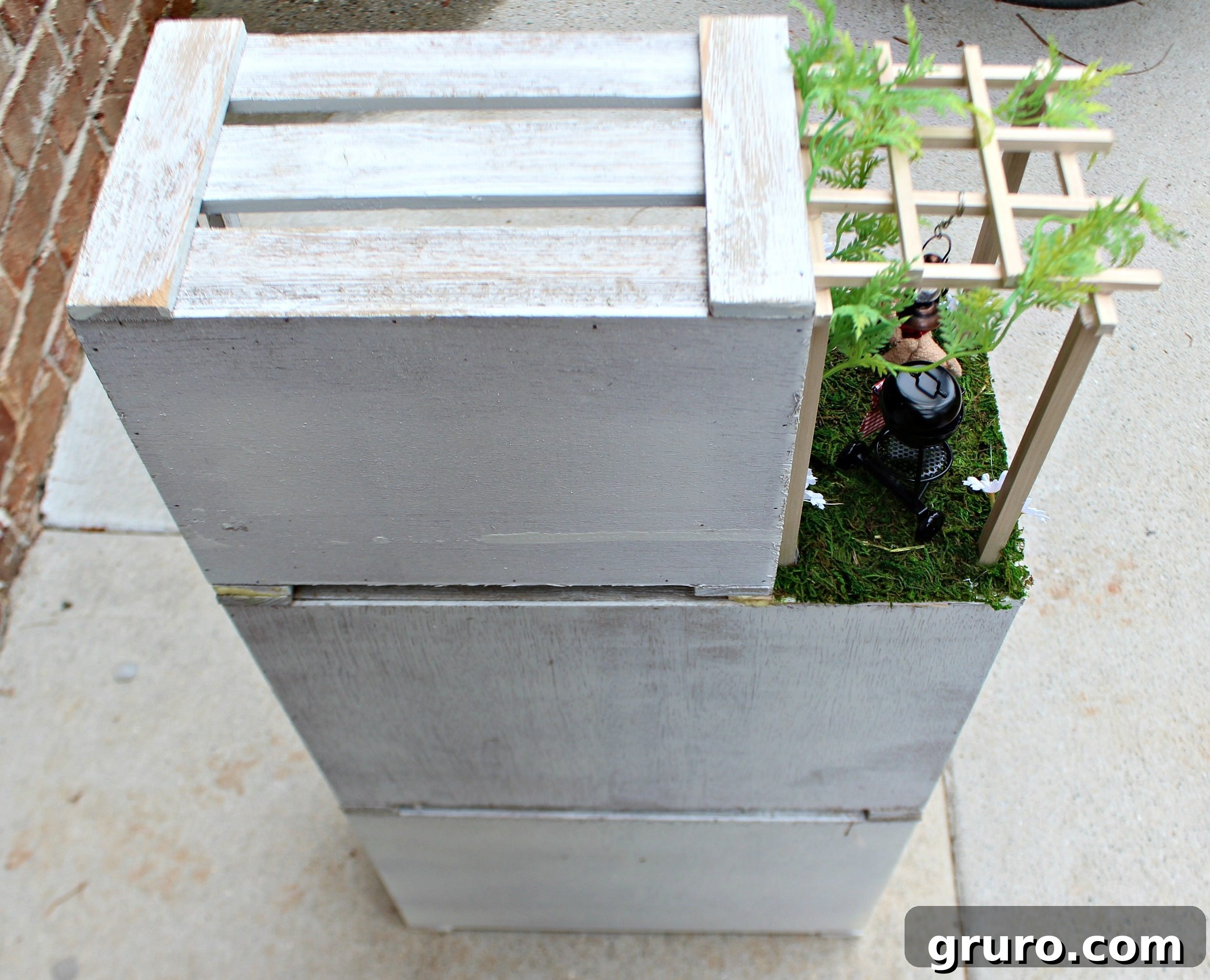 From Crates to Miniature Marvel 3 Back view of the handmade dollhouse from crates