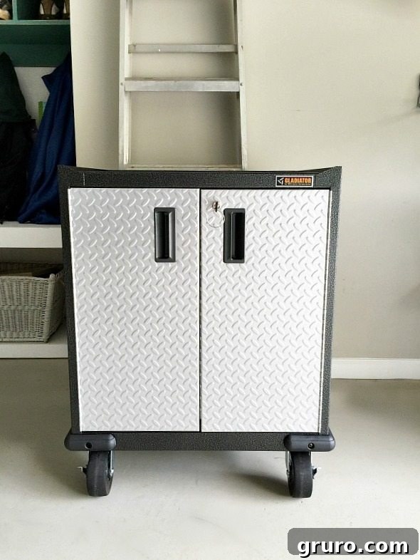 The fully organized interior of the Gladiator GarageWorks Modular GearBox, featuring a cushioned liner and dedicated space for small parts and tools.