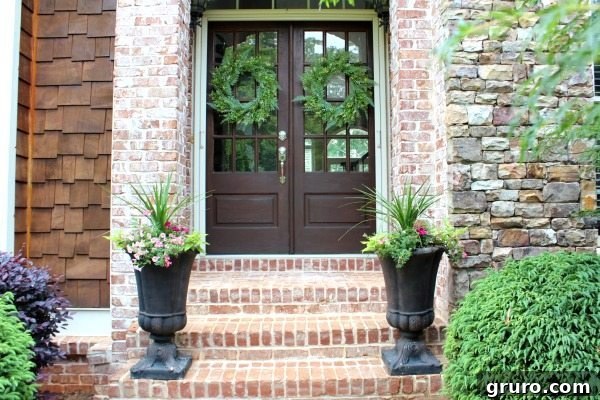 Double doors that say welcome to Refresh Restyle, adorned with summer wreath