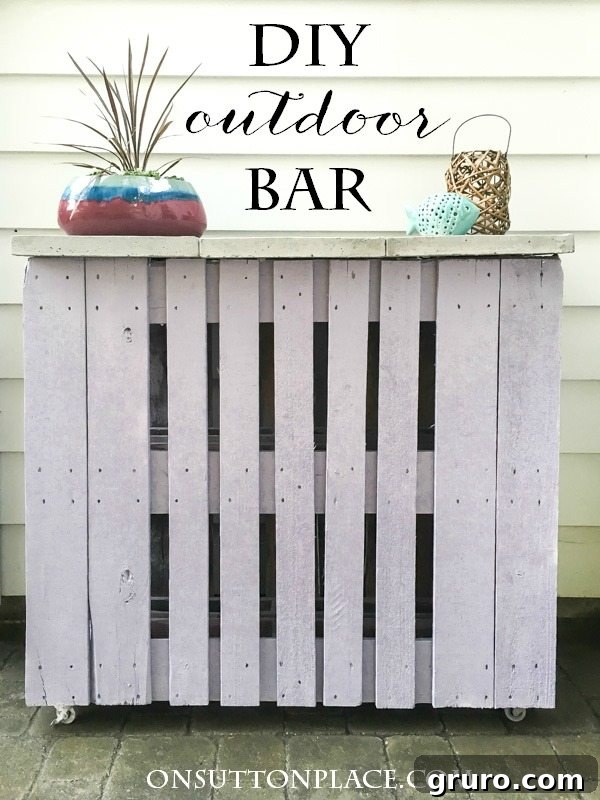 Monday Summer DIY Inspiration 3 A stylish DIY outdoor bar made from repurposed wooden pallets, perfect for summer entertaining and backyard parties.