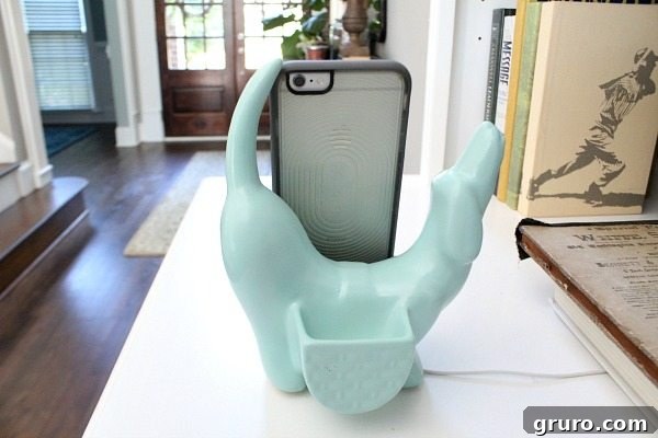 Vintage iPhone valet in a stunning milk glass finish on a living room bookcase