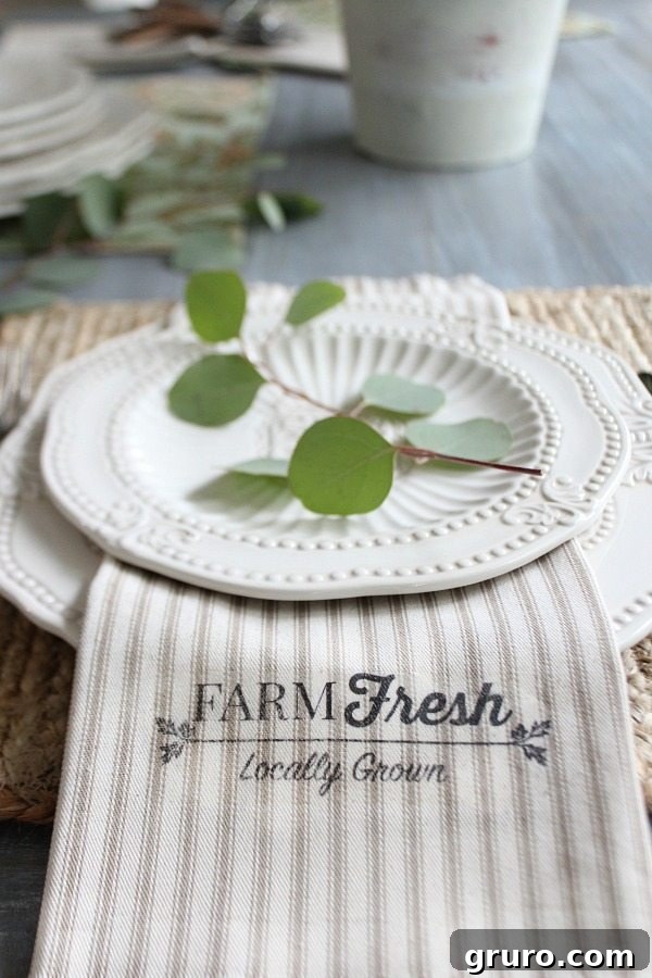 Get the farmhouse look with custom napkins made from 1 yard of fabric. Close-up of a 'Farm Fresh' farmhouse napkin, showcasing the crisp design and ticking fabric texture.