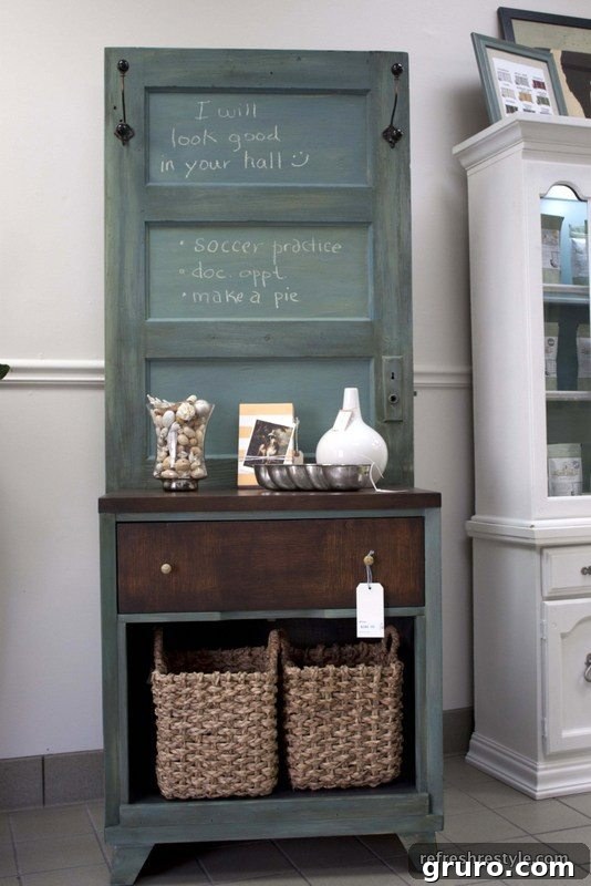Repurposed door and dresser combined to create a unique hall tree for entryway storage
