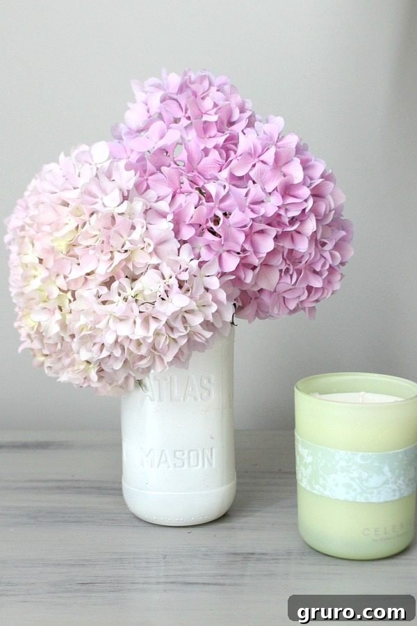 Repurposed and spray-painted mason jars, originally old spaghetti sauce jars, now stylish decor