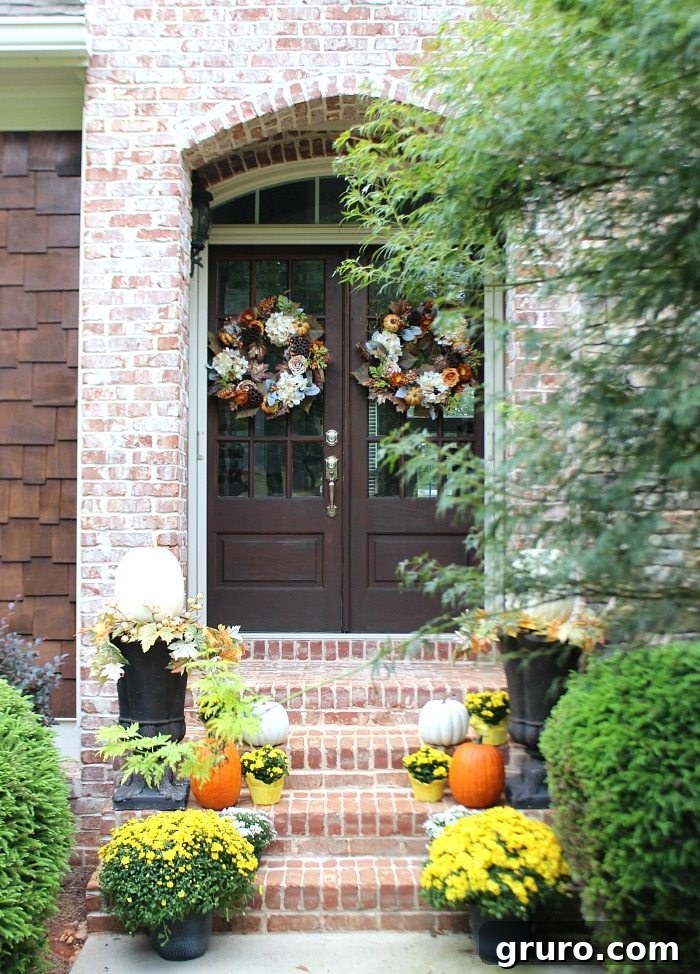 Cozy Fall Decor on a Budget 3 fall-front-porch-with-pumpkins-and-mums-plus-dark-stained-wood-doors-at-refresh-restyle