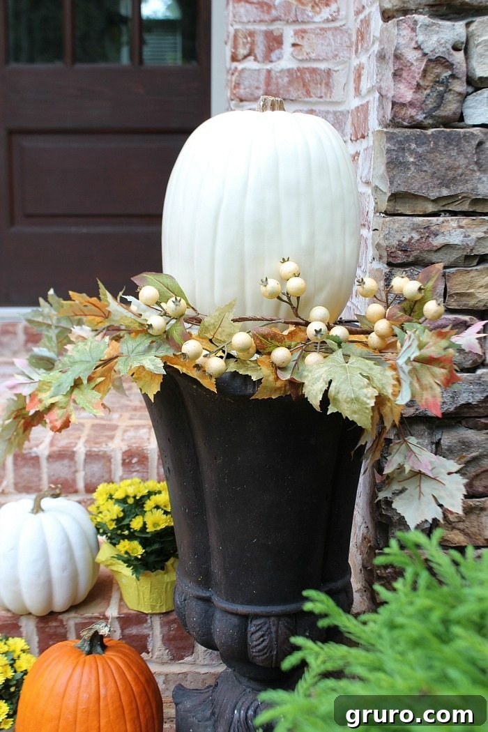 white-pumpkins-in-urns-with-berry-foliage-for-the-fall-front-door white-pumpkins-in-urns-with-berry-foliage-for-the-fall-front-door