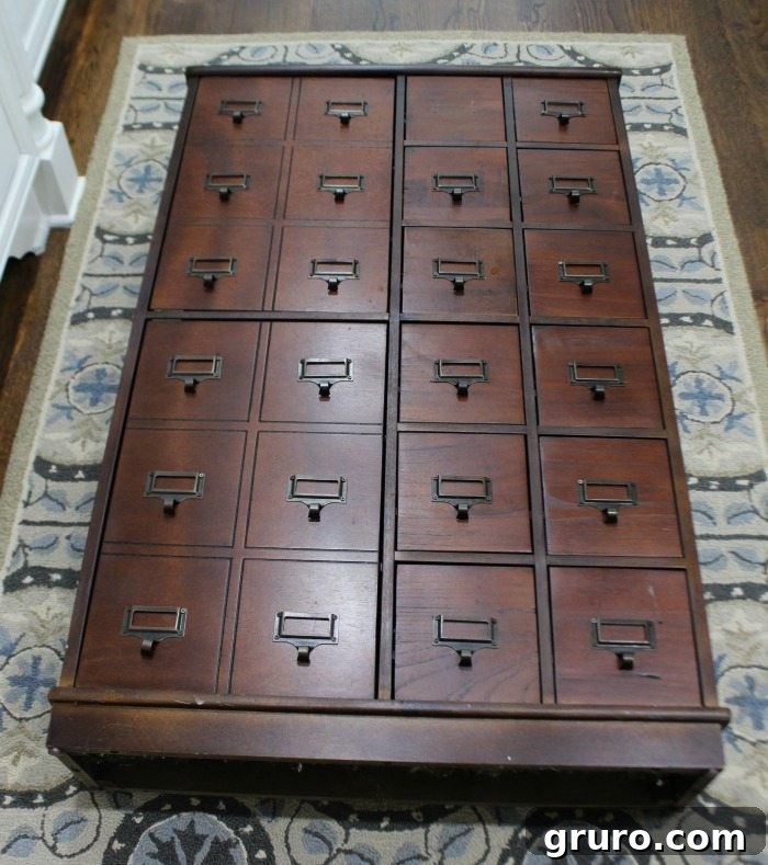 Removing Library Pulls Before Painting the Apothecary Cabinet