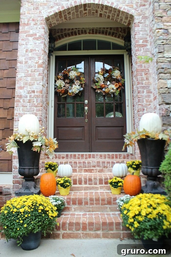mix-of-real-and-fake-pumpkins-with-white-and-yellow-mums