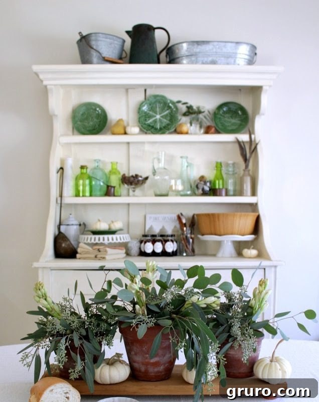 Fall dining table and hutch decorated with autumn accents