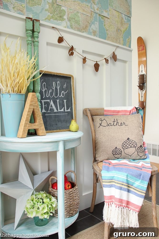 Beautiful light, bright, and airy fall home tour of a lakehouse featuring pops of coral and fall plaids at The Happy Housie