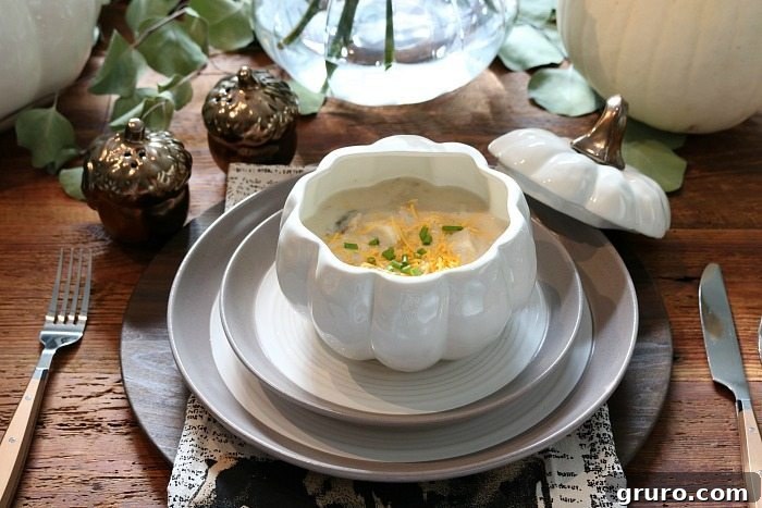 Farmhouse Autumn Gathering Table 12 Farmhouse table setting with potato soup served in a cute pumpkin soup bowl, highlighting the neutral and metallic elements