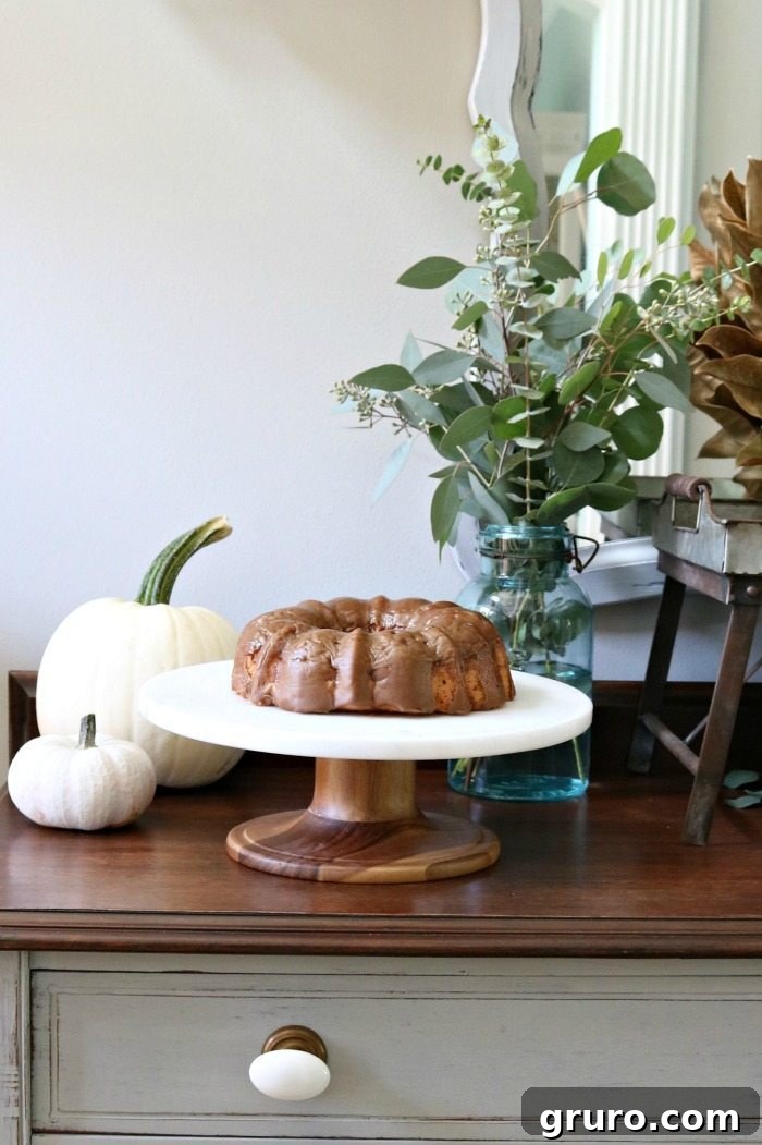 Farmhouse Autumn Gathering Table 13 Elegant wood and marble cake stand, perfect for showcasing desserts