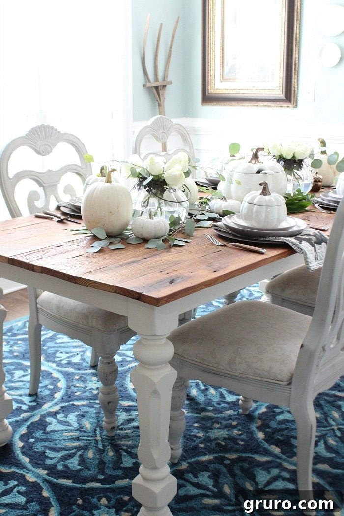 Farmhouse Autumn Gathering Table 5 Farmhouse table filled with white pumpkin decor and serve ware from Better Homes & Gardens at Refresh Restyle