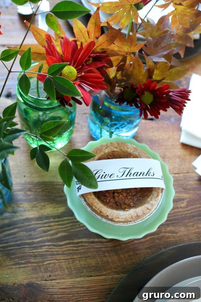 Vintage Blue Jar Table Accent 2 Rustic Thanksgiving centerpiece featuring blue mason jars filled with vibrant mums and fall foliage
