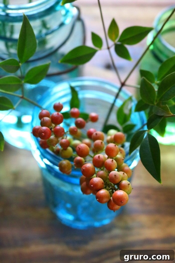 Vintage Blue Jar Table Accent 5 Blue mason jars filled with a delightful mix of fall berries and smaller floral accents