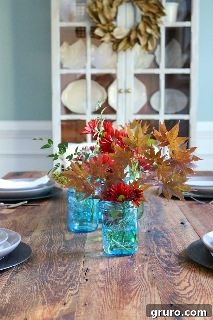 Vintage Blue Jar Table Accent 10 Classic blue mason jars elegantly displayed on a rustic barnwood farm table
