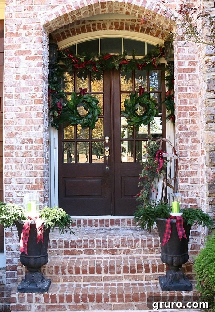 Rustic Christmas Porch with Farmhouse Plaid and Magnolia Wreaths Farmhouse plaid and magnolias make a pretty Christmas Welcoming Door
