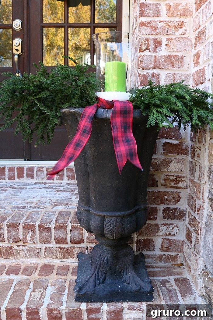 Rustic Christmas Porch: Simple Urn Filling with Greenery simple-idea-for-filling-the-urns-for-christmas-decorating