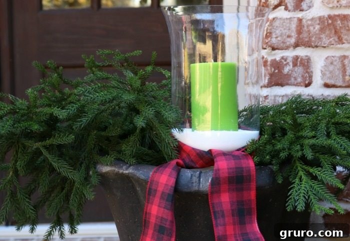 Green Candles and Plaid Ribbon - Rustic Christmas Porch Harmony green-candles-greenery-and-plaid-ribbon-for-the-christmas-front-porch
