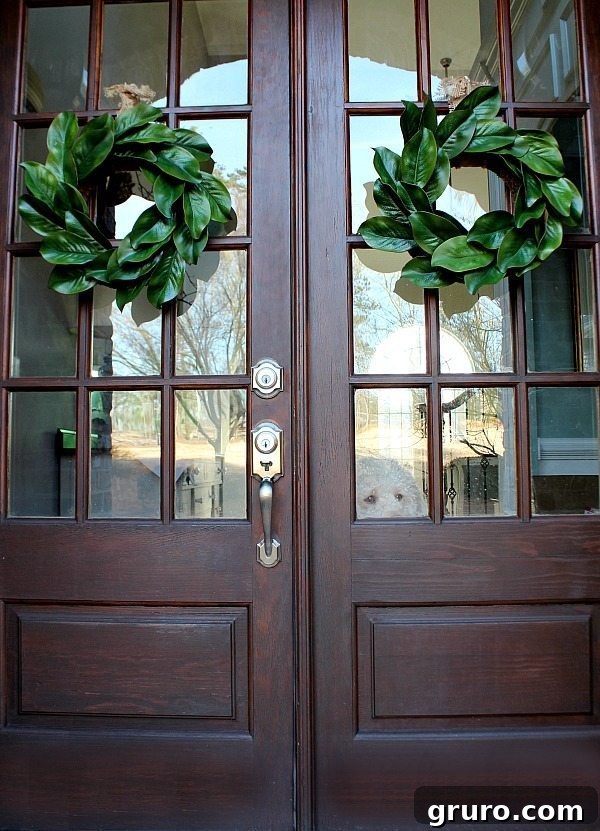 10 Timeless Farmhouse Decor Ideas 7 Double doors with Magnolia Wreaths - Ingredients for making a beautiful realistic looking affordable magnolia wreath for farmhouse decor
