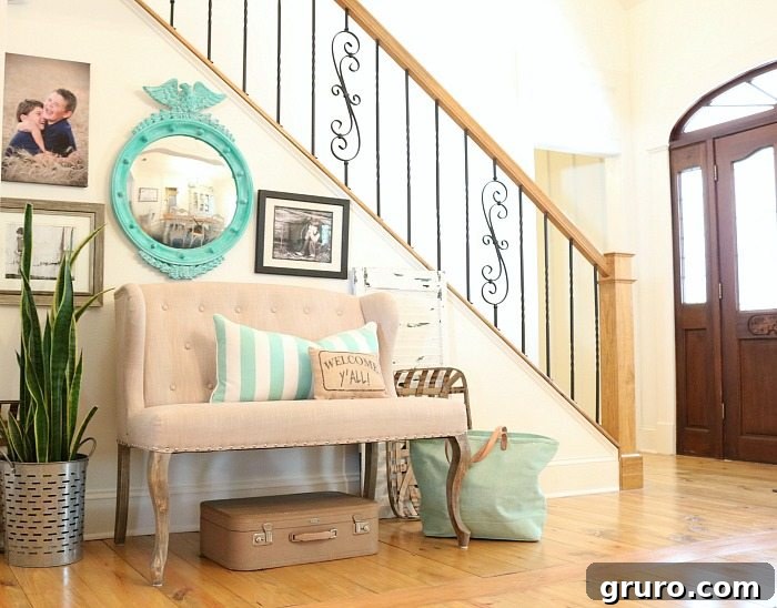 Bright and cheery entry way featuring the newly painted aqua and turquoise federal convex mirror, enhancing the home's welcoming ambiance.