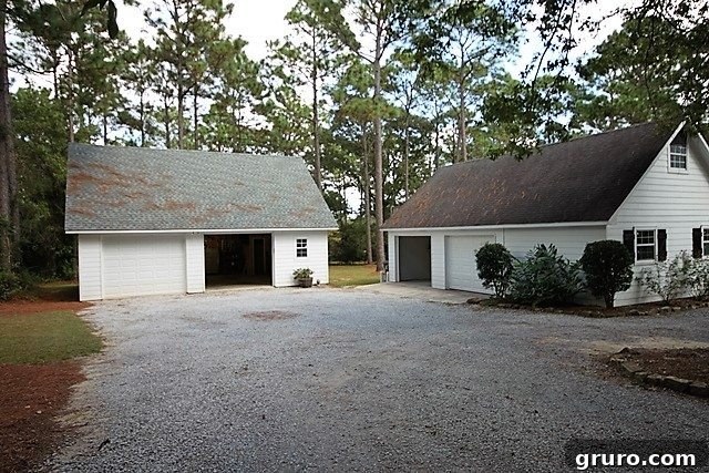 Cotton State Farmhouse 12 Two two-car garages before their transformation into a farmhouse cottage